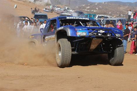 Rocking-across-desert-with-Baldwin,-Monster-Energy-truck