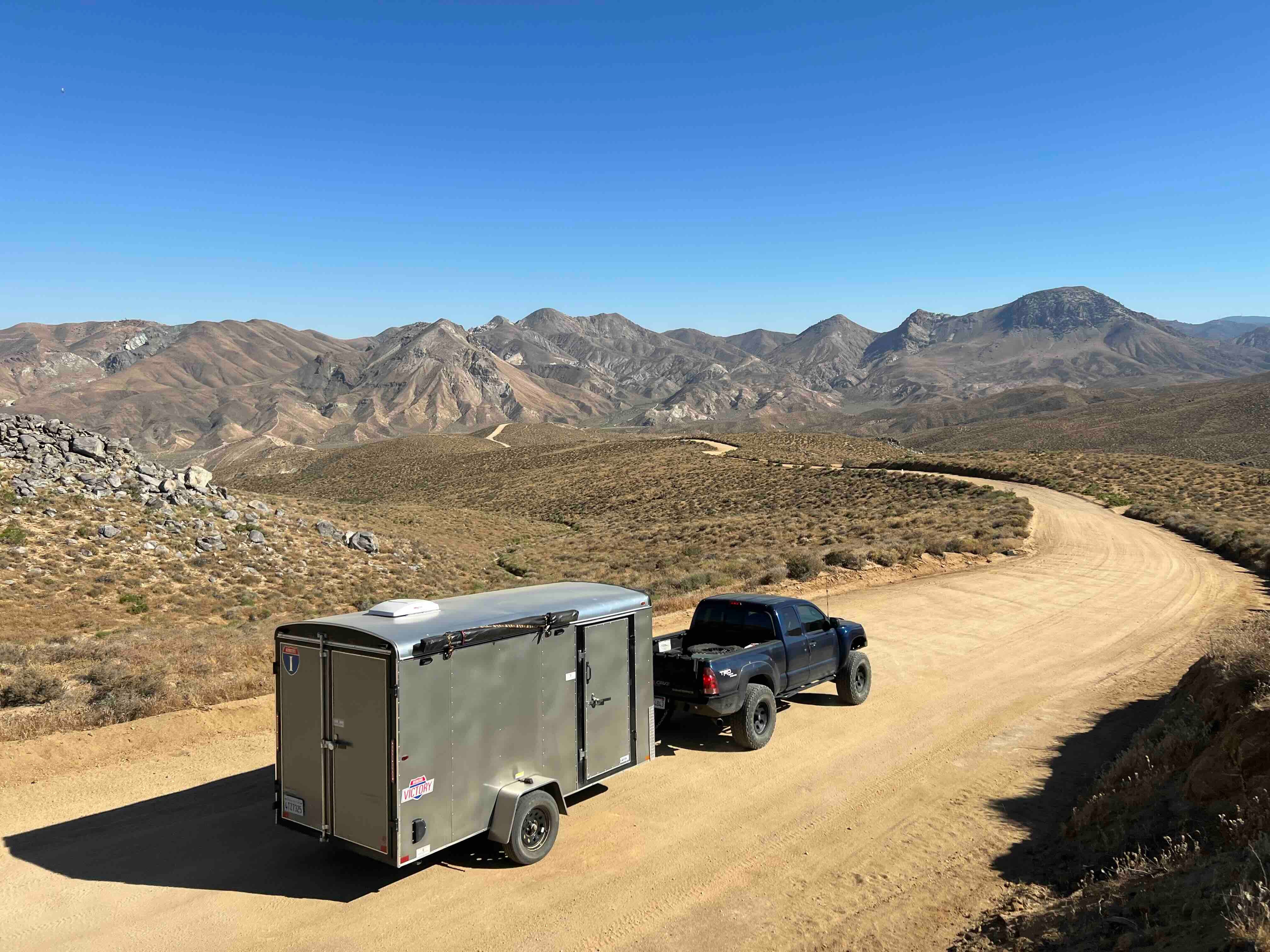 Our trucks and trailer somewhere in and around the Mojave. Photo credit: Saris Mercanti