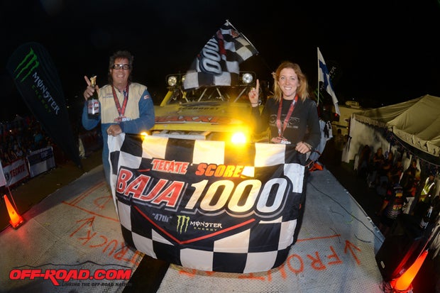 Paige Sohren at the finish line of the 2014 Baja 1000 with her father Pete Sohren who finished first in 7200.